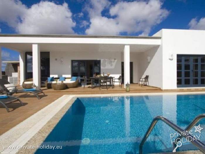 Private pool in front of white holiday home with terrace, Playa Blanca, Lanzarote